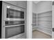 Modern kitchen with stainless steel appliances and a spacious pantry at 11909 Pippa Ave, Las Vegas, NV 89138