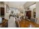 Elegant dining room featuring a stunning chandelier and view into the living room at 1329 Calle Cantar, Henderson, NV 89012