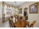 Formal dining room with chandelier, and adjacent butler's pantry at 1329 Calle Cantar, Henderson, NV 89012