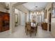 Elegant dining room with chandelier, decorative molding, and lots of natural light at 1329 Calle Cantar, Henderson, NV 89012