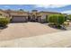 Charming single-story home featuring a decorative front door and a spacious three-car garage at 1329 Calle Cantar, Henderson, NV 89012