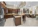 Spacious kitchen with an island, stainless appliances, and elegant cabinetry at 1329 Calle Cantar, Henderson, NV 89012