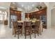 Stylish kitchen showcasing a central island, stainless appliances and custom cabinetry at 1329 Calle Cantar, Henderson, NV 89012