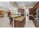 Open kitchen with a large island, granite countertops, and stainless steel appliances at 1329 Calle Cantar, Henderson, NV 89012