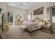 Spacious main bedroom featuring a king bed, sitting area, and an ensuite bathroom at 1329 Calle Cantar, Henderson, NV 89012