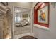 View of a luxury main bedroom featuring a tray ceiling, ceiling fan, and neutral carpeting and decor at 1329 Calle Cantar, Henderson, NV 89012