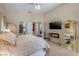 Spacious main bedroom featuring a king bed, fireplace, and an ensuite bathroom at 1329 Calle Cantar, Henderson, NV 89012