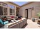 Inviting outdoor patio area with comfortable seating and desert landscaping at 1329 Calle Cantar, Henderson, NV 89012