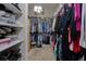 A walk-in closet featuring built-in shelves and rods with plenty of storage space at 1329 Calle Cantar, Henderson, NV 89012