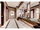 Modern bathroom with marble floors, granite countertop, vessel sinks, and decorative lighting fixtures at 135 E Harmon Ave # 1703, Las Vegas, NV 89109
