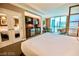Bright bedroom features a partial kitchen, dining area, and expansive windows at 135 E Harmon Ave # 1703, Las Vegas, NV 89109