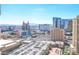 Expansive city view showing high-rise buildings and parking area under a clear sky in Las Vegas at 135 E Harmon Ave # 1703, Las Vegas, NV 89109