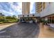 Elegant porte cochere with a circular driveway featuring lush landscaping at 135 E Harmon Ave # 1703, Las Vegas, NV 89109