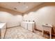 Functional laundry room with multiple washing machines, dryer, and utility sink at 135 E Harmon Ave # 1703, Las Vegas, NV 89109