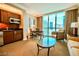 Well-lit living area with kitchenette, dining table and seating offering city views at 135 E Harmon Ave # 1703, Las Vegas, NV 89109