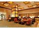 Grand lobby with comfortable seating, stylish decor, stone column, and a warm, inviting atmosphere at 135 E Harmon Ave # 1703, Las Vegas, NV 89109