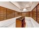 Clean, well-lit mailroom with rows of mailboxes and a central table for convenience at 135 E Harmon Ave # 1703, Las Vegas, NV 89109