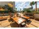 Inviting outdoor patio with comfortable seating and elegant string lights, perfect for relaxing and entertaining guests at 135 E Harmon Ave # 1703, Las Vegas, NV 89109