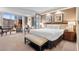 Bright bedroom with a cityscape view, desk, living room seating, and a comfortable bed at 135 E Harmon Ave # 407, Las Vegas, NV 89109