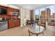 Well-equipped kitchenette and dining area with bright sunlight and city views at 135 E Harmon Ave # 407, Las Vegas, NV 89109