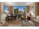 Inviting living room area and city views at 135 E Harmon Ave # 407, Las Vegas, NV 89109