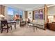 Comfortable living area offers city views, a seating area and a dining space at 135 E Harmon Ave # 407, Las Vegas, NV 89109
