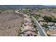 Desert community aerial view featuring single-Gathering homes and a well-maintained roadway at 1744 Williamsport St, Henderson, NV 89052