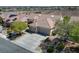 Expansive aerial view of a well-maintained home in a desert community with beautiful mountain views at 1744 Williamsport St, Henderson, NV 89052