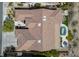 Aerial view showcasing a home's roof, backyard oasis with a pool, spa, and well-manicured landscaping at 1744 Williamsport St, Henderson, NV 89052