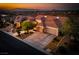 Beautiful aerial view of a home in a well planned community with a large drive and mountain views at 1744 Williamsport St, Henderson, NV 89052