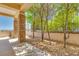Covered back patio with stone pillars and landscaping providing relaxing outdoor living at 1744 Williamsport St, Henderson, NV 89052