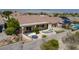 Inviting backyard space featuring a fire pit, a spa, desert landscaping, and privacy fencing at 1744 Williamsport St, Henderson, NV 89052