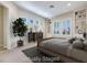 Staged bedroom featuring a built-in bookcase, a decorative window, and carpet at 1744 Williamsport St, Henderson, NV 89052