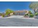 Beautiful home featuring a landscaped front yard, stone accents, large driveway, and a 3-car garage at 1744 Williamsport St, Henderson, NV 89052