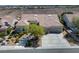 Inviting single-story home with desert landscaping, a tile roof, and a paved driveway at 1744 Williamsport St, Henderson, NV 89052
