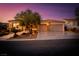 Beautiful home featuring a landscaped front yard, stone accents, large driveway, and a 3-car garage at 1744 Williamsport St, Henderson, NV 89052