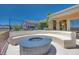 Stylish outdoor area with built-in seating and a cozy fire pit, ideal for entertaining guests at 1744 Williamsport St, Henderson, NV 89052