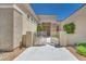 Close up of the front entrance featuring a gated entry with landscaped grounds and decorative rock at 1744 Williamsport St, Henderson, NV 89052