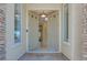 View of an inviting home entrance featuring double doors, windows, and a view into the home at 1744 Williamsport St, Henderson, NV 89052