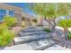 Charming single-story home featuring a landscaped front yard, stone accents and a welcoming entrance at 1744 Williamsport St, Henderson, NV 89052