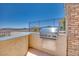Outdoor kitchen area with a built-in grill, perfect for backyard barbecues and entertaining at 1744 Williamsport St, Henderson, NV 89052