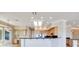 Kitchen area features natural lighting, wood cabinets, and granite countertops with modern stainless appliances at 1744 Williamsport St, Henderson, NV 89052