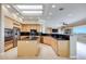 Spacious kitchen with stainless steel appliances, wooden cabinets, and a large island with sink at 1744 Williamsport St, Henderson, NV 89052