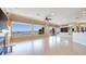 Bright and spacious living room featuring large windows with backyard and pool views at 1744 Williamsport St, Henderson, NV 89052
