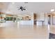 Bright living room features an open layout, sleek floors, and a large island kitchen area at 1744 Williamsport St, Henderson, NV 89052