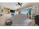This virtually staged living room features great lighting, open shelving, and views of the outdoors at 1744 Williamsport St, Henderson, NV 89052