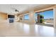 Bright living room featuring a fireplace, built-in shelves, and a sliding glass door leading to the outside at 1744 Williamsport St, Henderson, NV 89052