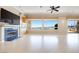 Bright living room with fireplace, large windows, and access to the outdoor space and view at 1744 Williamsport St, Henderson, NV 89052