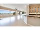 Open concept living space with large windows showcasing views, sleek countertops, and modern lighting at 1744 Williamsport St, Henderson, NV 89052