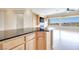 Open-concept space with a kitchen counter, seamlessly connecting the kitchen to the living room at 1744 Williamsport St, Henderson, NV 89052